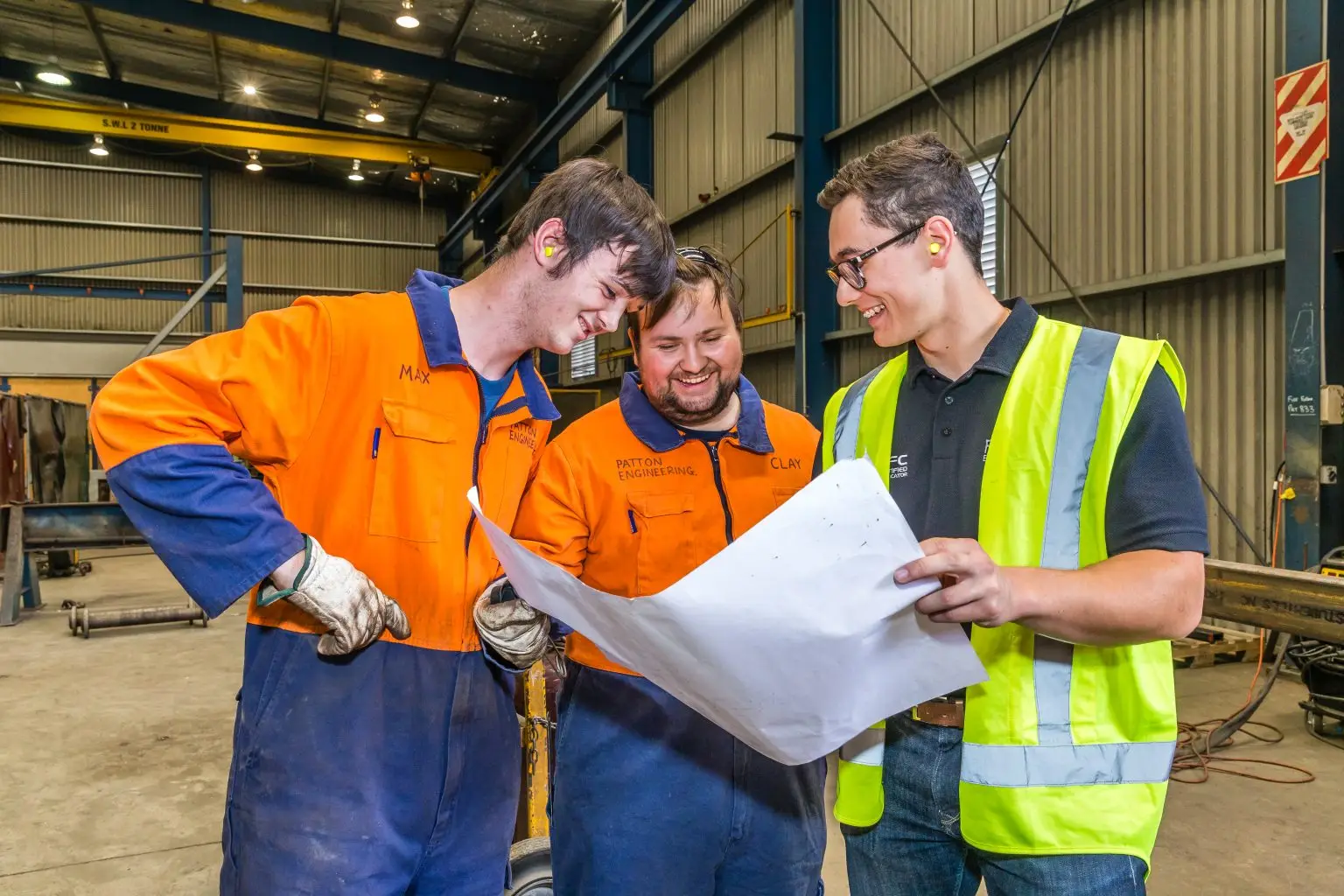 Mechanical engineer reviewing blueprints for a new project